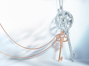 silver-colored and gold-colored skeleton key pendants HD wallpaper