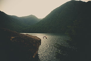 body of water, landscape, jumping