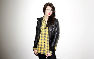 women's yellow and black plaid button-up shirt and black leather jacket