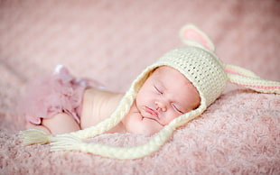 toddler's beige knit hat, baby