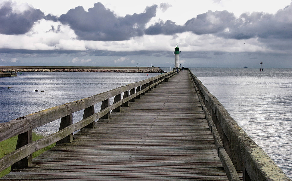brown pier near white and black lighthouse HD wallpaper