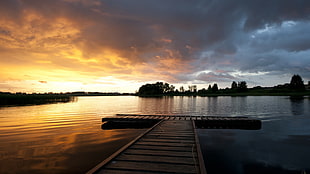 brown wooden beach dock near island under white clouds at sunrise HD wallpaper