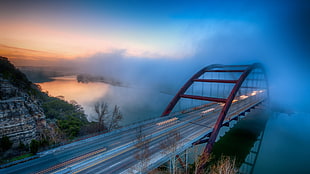red and blue bridge over body of water HD wallpaper