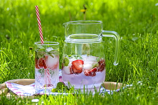 clear glass pitcher beside drinking glass