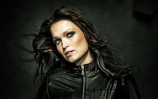 woman wearing black leather zippered jacket
