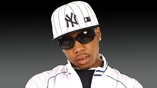 man wearing white New York Yankees fitted cap