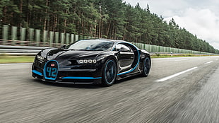 black Bugatti Veyron running fast on gray concrete road during daytime HD wallpaper