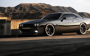 Dodge Challenger parked near concrete wall