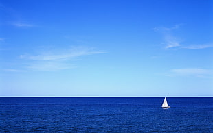 white sailing boat on ocean during daytime HD wallpaper