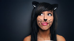 woman in black hair and cat makeup