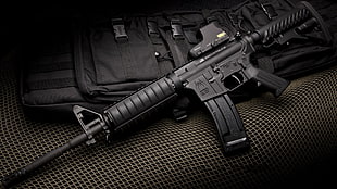 black assault rifle with bag HD wallpaper