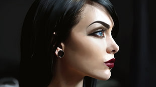woman wearing black earring and red lipstick