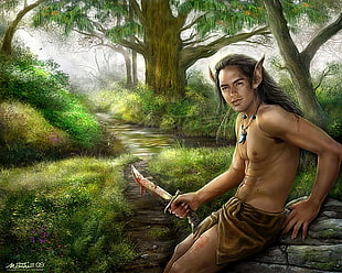 man holding black handled knife near trees during daytime
