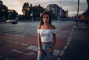 woman in white off-shoulder crop top in tilt shift photography