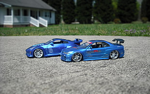 two blue R/C coupes