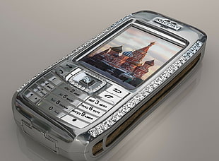 closeup photo of silver Ancort candybar phone with Saint Basil's Cathedral, Russia wallpaper
