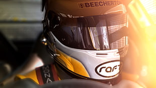 racer in white and yellow helmet