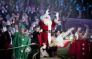 white haired Santa Clause with group of people
