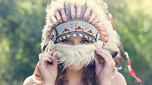 woman wearing pink fur feather headdress