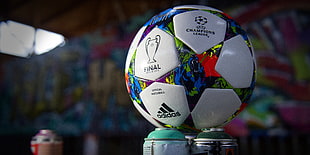 selective focus photo of white Adidas Champion League soccer ball