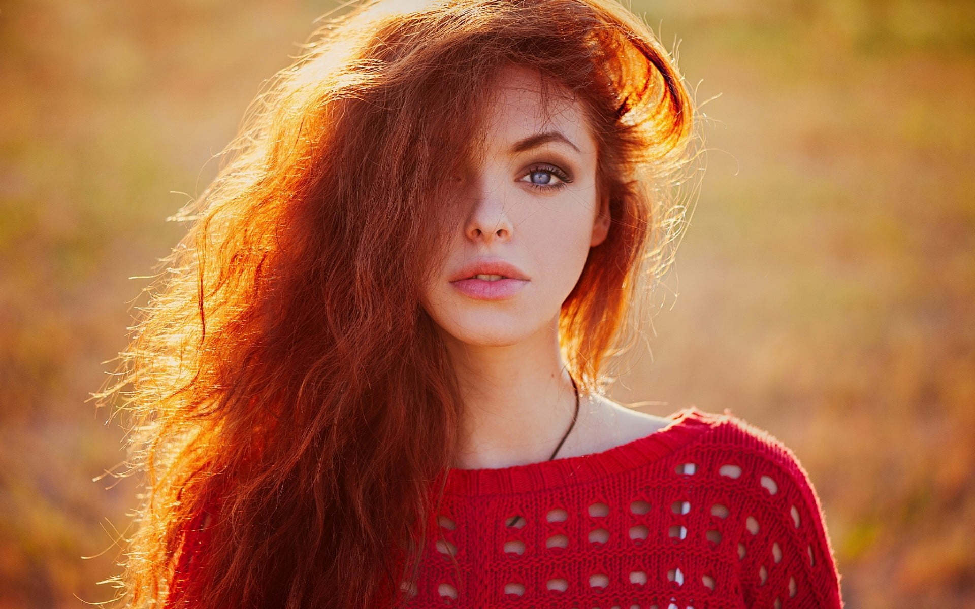 photographed of woman wearing red crew-neck top