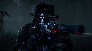 person holding hunting rifle during night time HD wallpaper