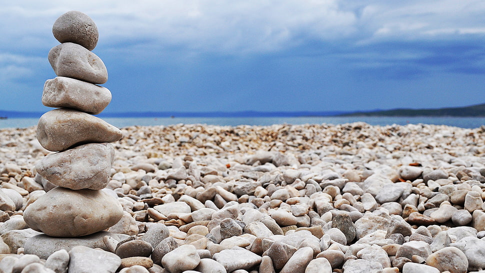selective focus photography of stacked stones HD wallpaper