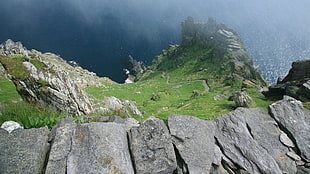 rocky mountain near body of water