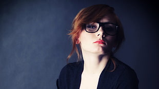 woman wearing black eyeglasses