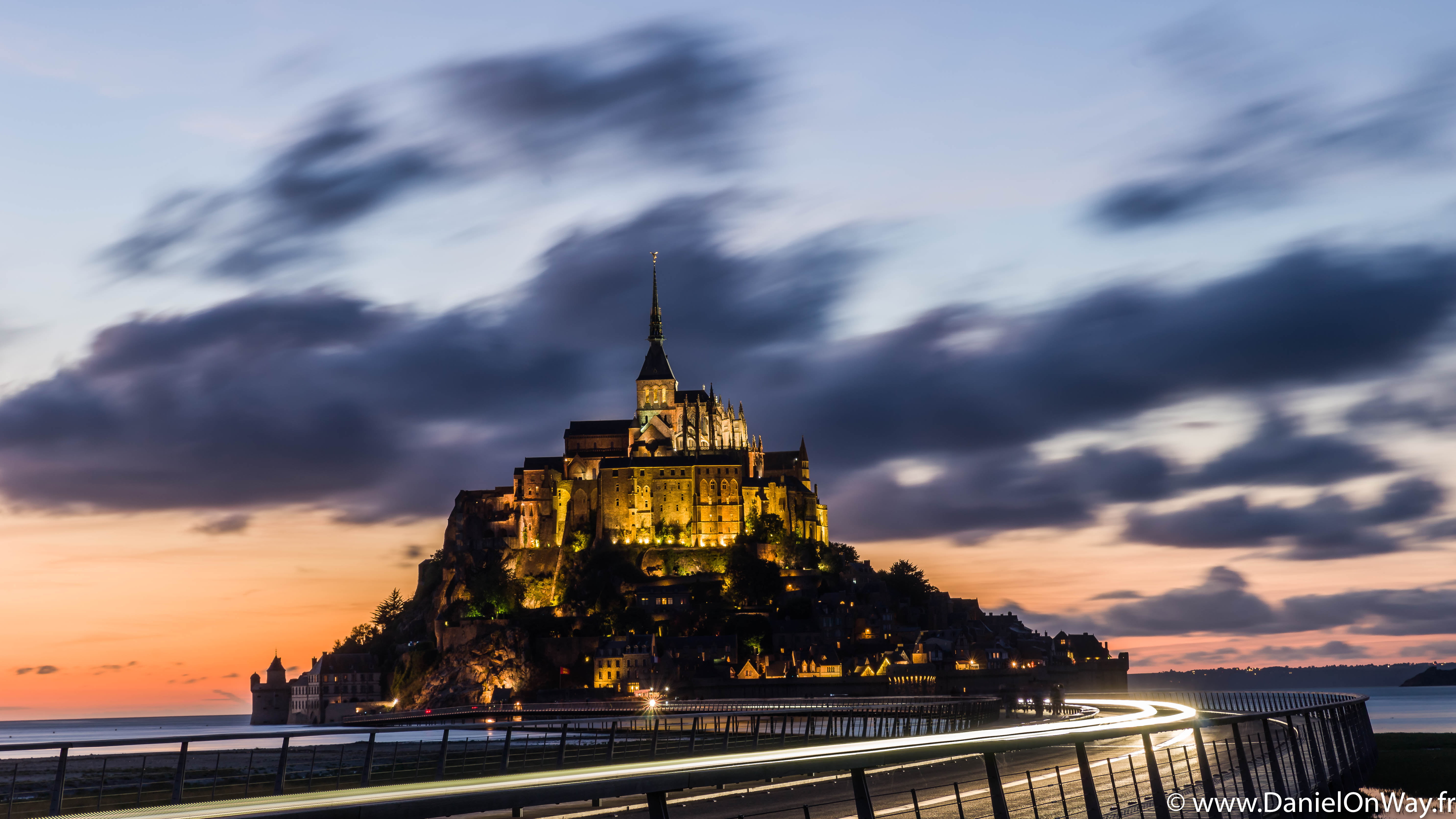 timelapse photo of castle surrounded by body of water near the bridge, mont saint michel