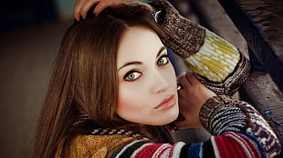 woman wearing brown and red sweater