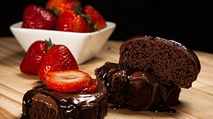 chocolate cake with slice strawberry in close-up photography