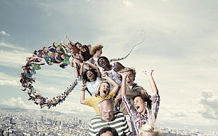 group people riding sky roller air coaster