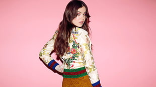 photo of woman in white and multicolored long-sleeved blouse