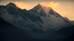 snow covered mountains at golden hour