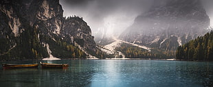 landscape photography of mountains beside body of water