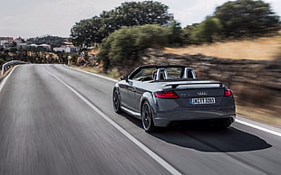 silver Audi convertible on the road during daytime