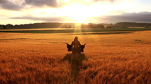 woman standing in the middle of field