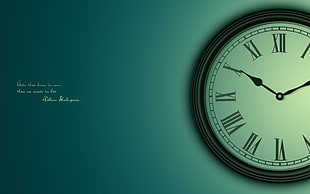round analog wall clock at 10:10
