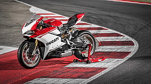 red and white Ducati sports bike