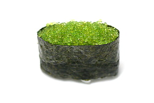 photo of green gemstone on black pouch