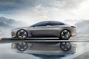 grey sports coupe with reflection below water