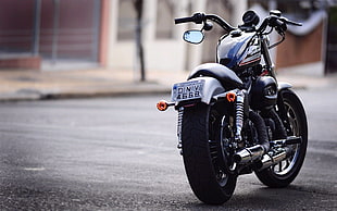 photo of black cruiser motorcycle during daytime