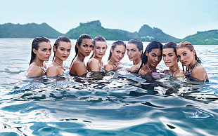 group of women in body of water at daytime HD wallpaper