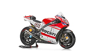 red and white Ducati motorcycle