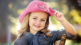 girl wearing pin knitted hat and blue denim dress