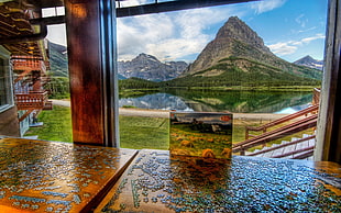 glass wall with brown wooden base, nature, landscape, hills, lake