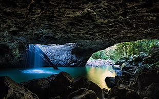cave with calm body of water during daytime, nature, landscape, pond, cave