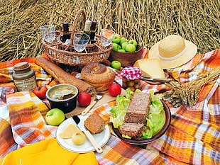 foods and drinks on picnic mat