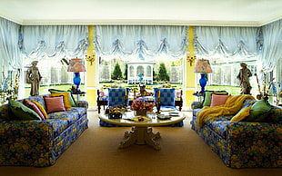 living room with blue-and-yellow floral sofa set